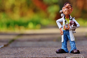 Veterinarian Figurine Holding Dog And Owl On Gravel Path