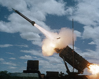 Military Rocket Launcher Firing Missile During Daytime Training Exercise