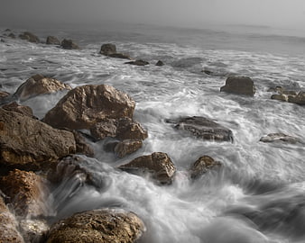 Long Exposure Misty Ocean Waves Crashing on Rocky Shore