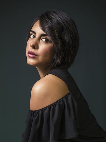 Elegant Studio Portrait of Young Woman in Black Off-Shoulder Dress