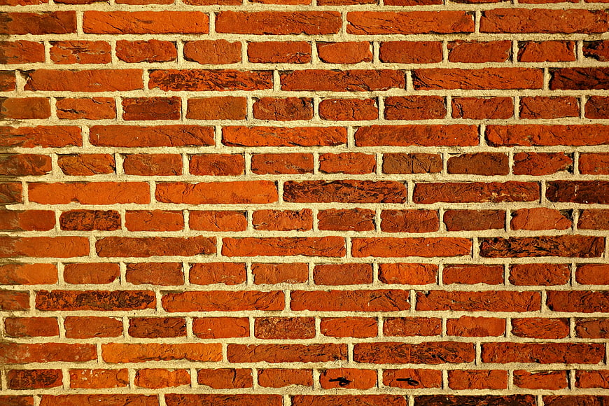 Textured Red Brick Wall Pattern Background