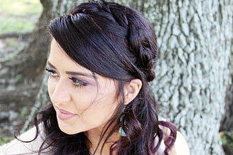 Young Woman with Braided Hairstyle in Nature
