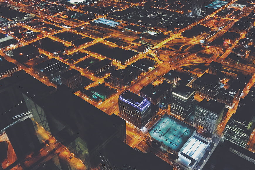 Aerial Night View of Chicago Cityscape with Glowing Streets