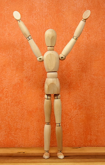 Wooden Articulated Doll Celebrating Victory With Raised Arms