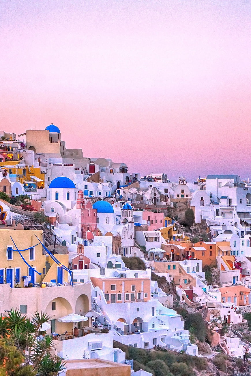 Santorini Sunset View with Blue Domes and White Buildings