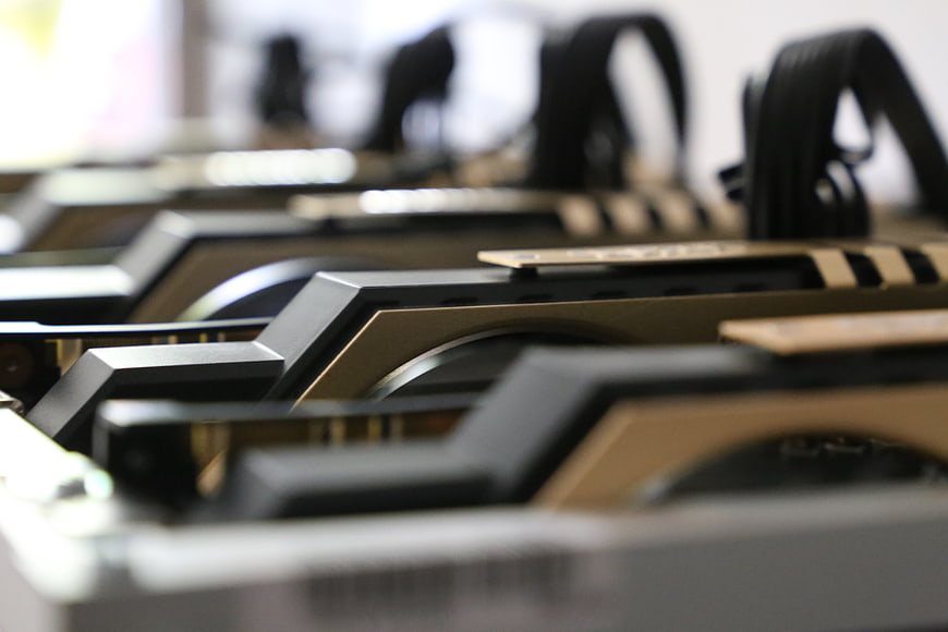 Close-up of GPU graphics cards arranged in a row for cryptocurrency mining