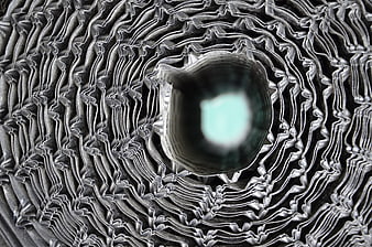 Abstract metallic spiral texture with glowing center