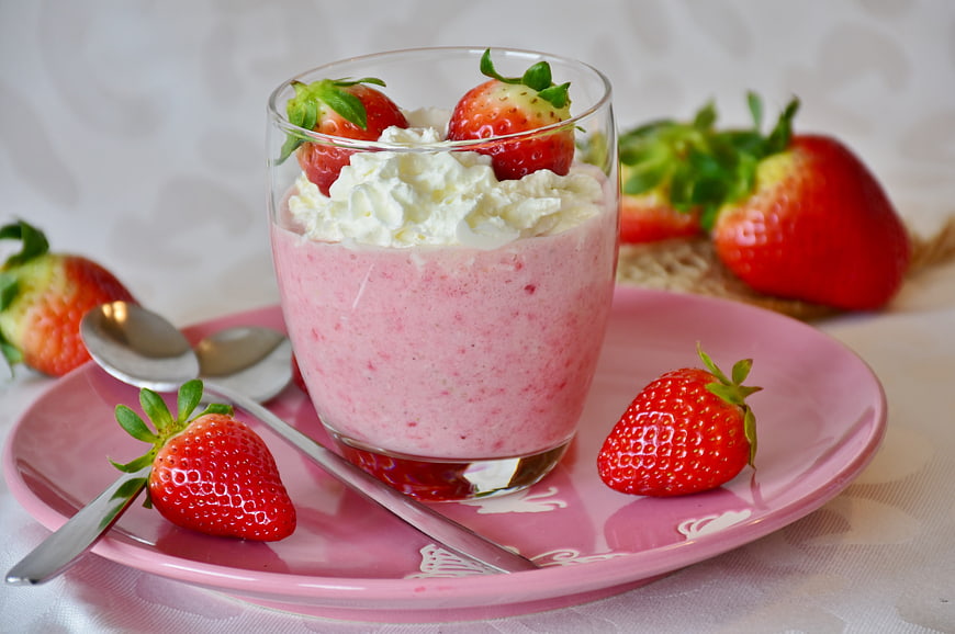 Fresh Strawberry Smoothie with Whipped Cream and Berries