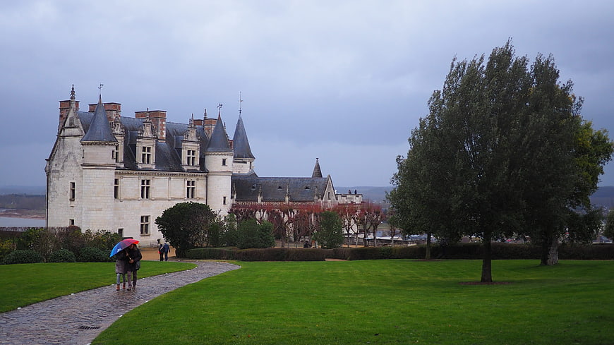 Historic French Chateau on Overcast Day with Visitors