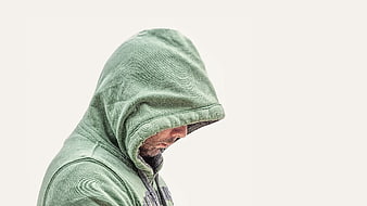 Man in Green Hoodie Looking Down Isolated on White