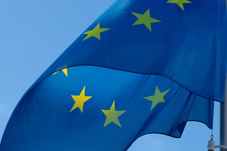 European Union Flag Waving Against Blue Sky