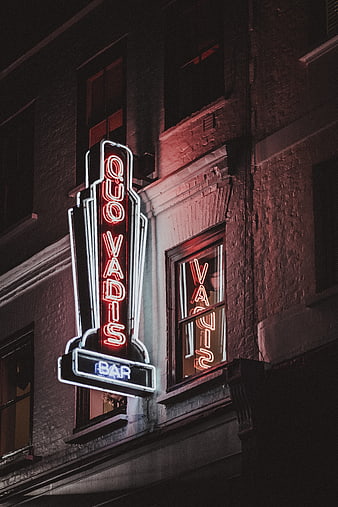 Quo Vadis Bar Neon Sign at Night