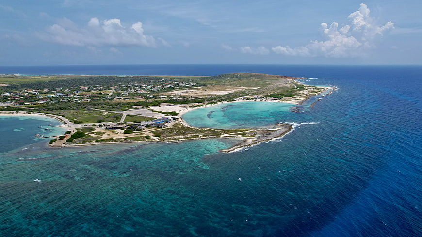 Aerial View of Tropical Island Coastline with Turquoise Lagoon