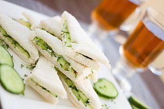 Cucumber Sandwiches with Tea on White Plate