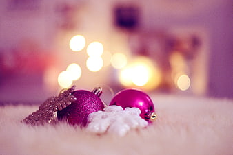 Pink Christmas Ornaments on White Fur with Bokeh Lights
