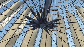 Low angle view of modern tensile fabric roof structure