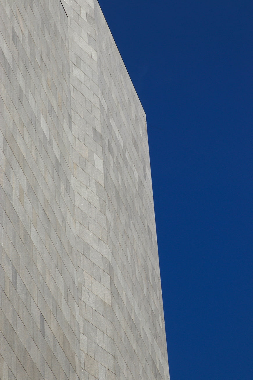 Modern Concrete Building Facade Against Blue Sky