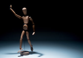 Wooden Mannequin on Stand with Blue Background