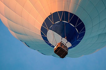 Hot Air Balloon Basket View From Below Against Blue Sky