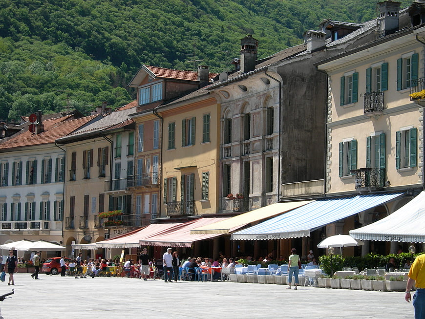 Sunny European Town Square with Cafes and Mountains