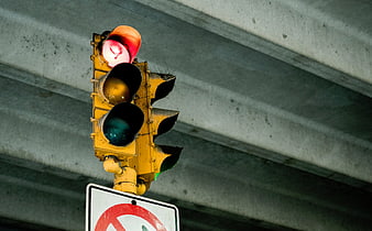 Red Traffic Light Under Concrete Overpass