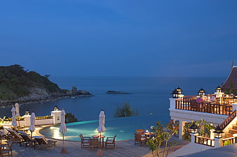 Luxury Resort Infinity Pool Overlooking Ocean At Dusk