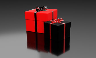 Red and Black Gift Boxes with Ribbons on Reflective Surface