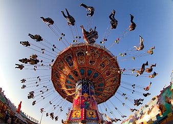 Low angle view of swinging carousel ride at Oktoberfest Munich