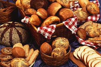 Assortment of fresh artisan breads in wicker baskets