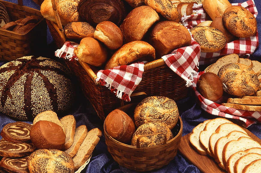 Assortment of fresh artisan breads in wicker baskets
