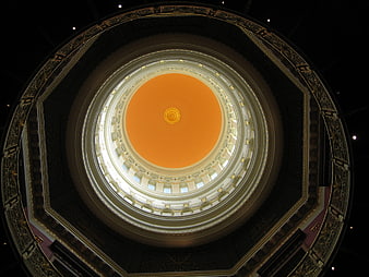 Upward view of ornate rotunda dome ceiling with golden details