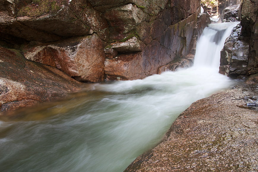 Long Exposure Waterfall Flowing Over Granite Rocks