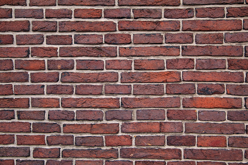 Textured Red Brick Wall Background Pattern