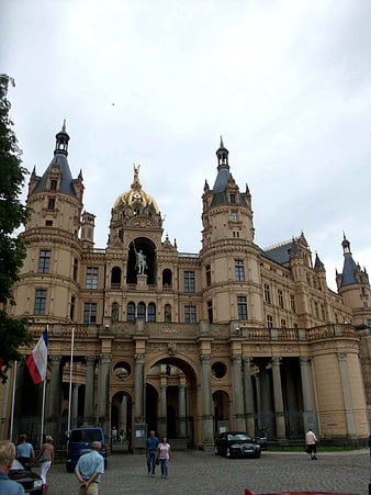 Schwerin Castle Architecture with Golden Dome and French Flag