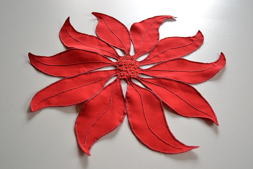 Red Fabric Poinsettia Flower Decoration on White Background