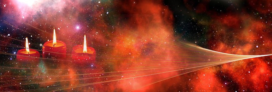 Three red candles against a vibrant cosmic nebula background