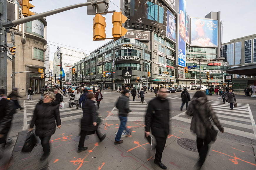 Busy City Intersection with Pedestrians and Billboards