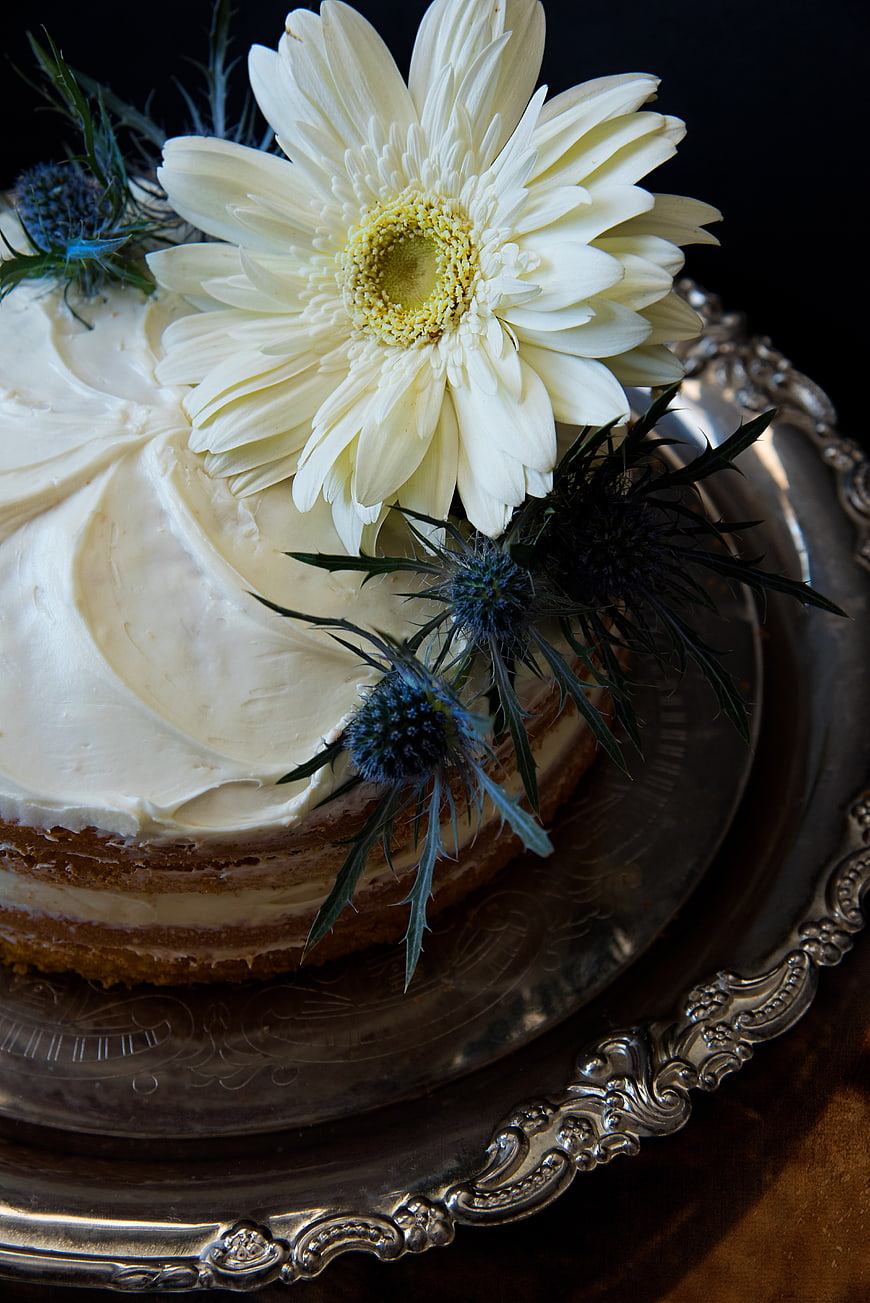 Elegant Naked Cake with White Gerbera and Thistle on Silver Platter