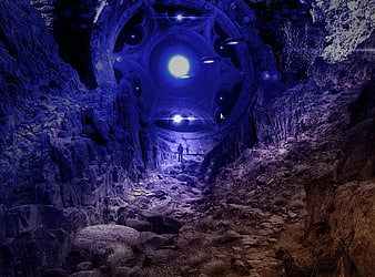Futuristic UFO hovering in a dark rocky canyon with a lone figure