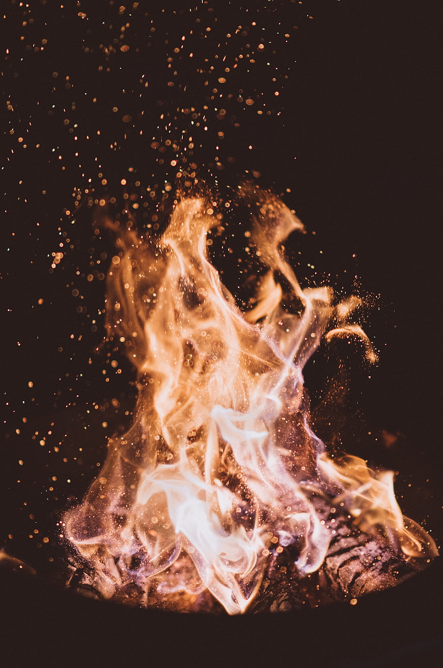 Close-up of burning fire with glowing embers and sparks