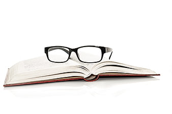 Open Book With Black Eyeglasses On White Background