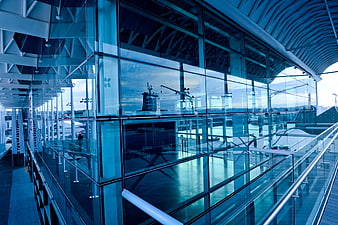 Modern Glass Architecture with Blue Tint and Reflections