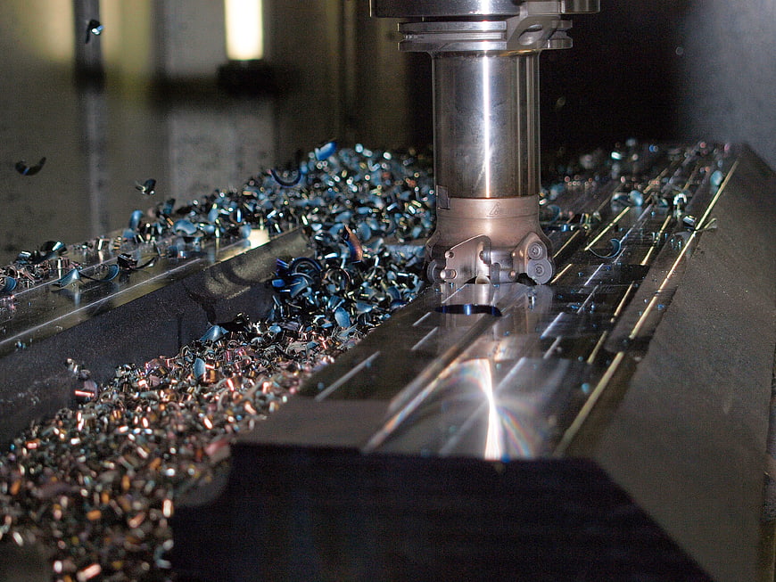 CNC Milling Machine Cutting Metal with Flying Chips