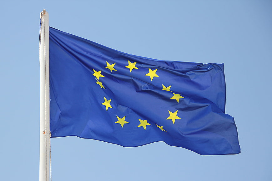 European Union Flag Waving Against Clear Blue Sky