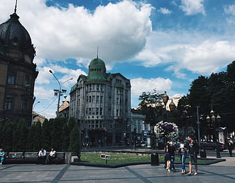City Square with Historic Buildings and Pedestrians
