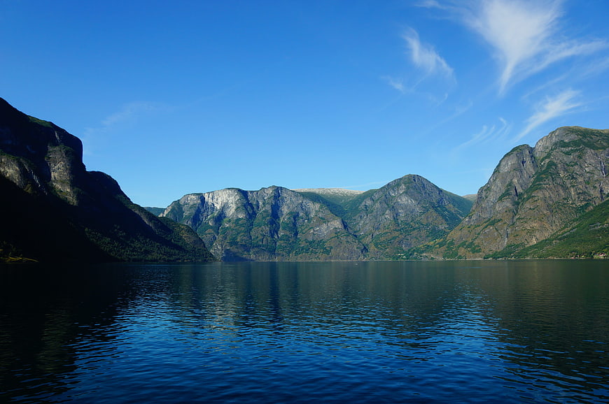 Scenic Norwegian Fjord with Mountains and Blue Sky
