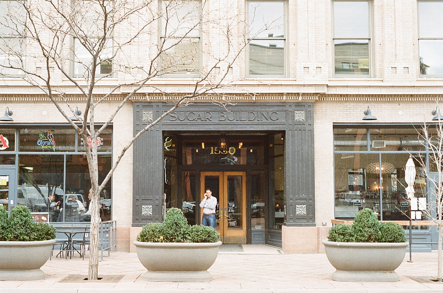 Sugar Building Entrance with Man on Phone