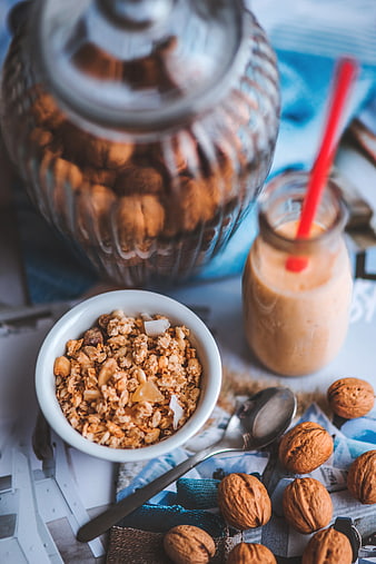 Healthy granola bowl with walnuts and smoothie