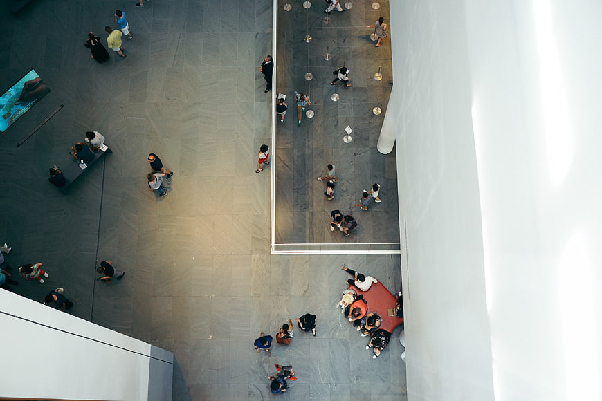 Aerial view of people in modern museum lobby