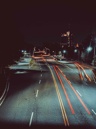 Long exposure night city street with light trails